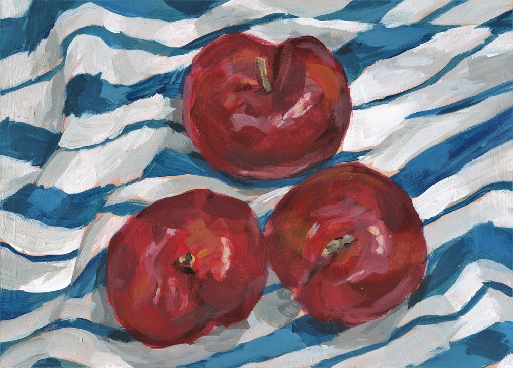 Des pommes fraîches sur un fond rayé - Carrie Arnold