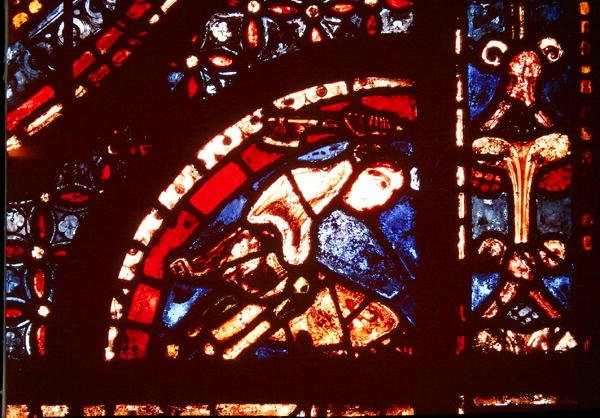 Un boucher, détail du coin inférieur droit de la fenêtre des Miracles de la Vierge dans le bas-côté sud de la nef, 1205-15 - French School