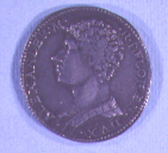 Pièce de monnaie décorée de la tête d