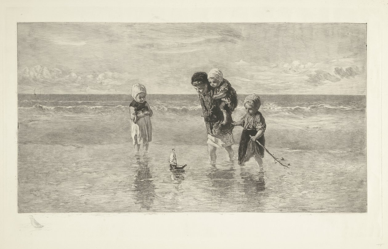 Quatre enfants jouent avec un bateau jouet sur la plage dans l