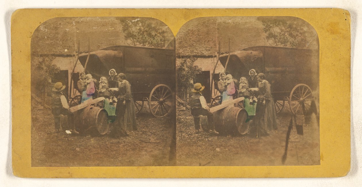 [Groupe familial devant un chariot, le père et l