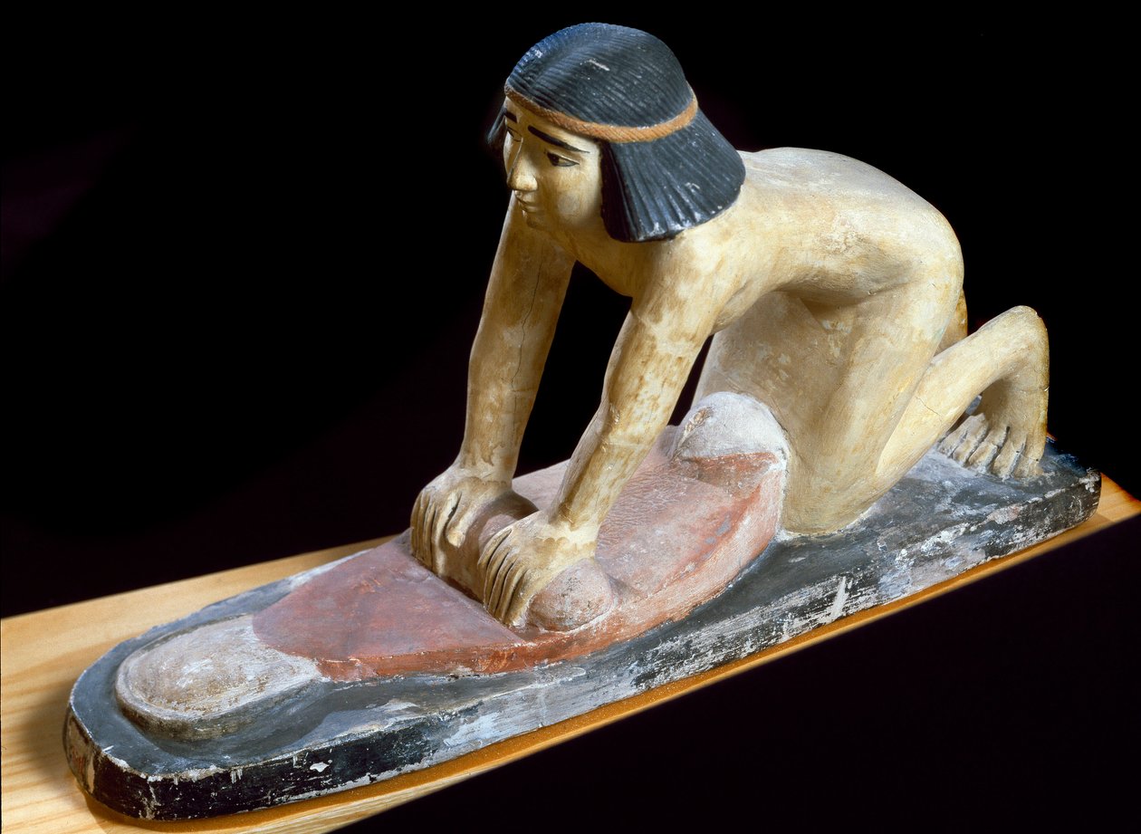 Antiquité égyptienne: Égyptien écrasant des céréales pour faire du pain. Figurine. 5e dynastie. 2400 av. J.-C. Florence, Museo Archeologico - Egyptian 5th Dynasty