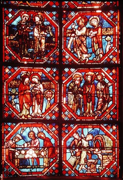 Vitrail représentant les parents du Christ et des boulangers cuisant et vendant du pain, de l