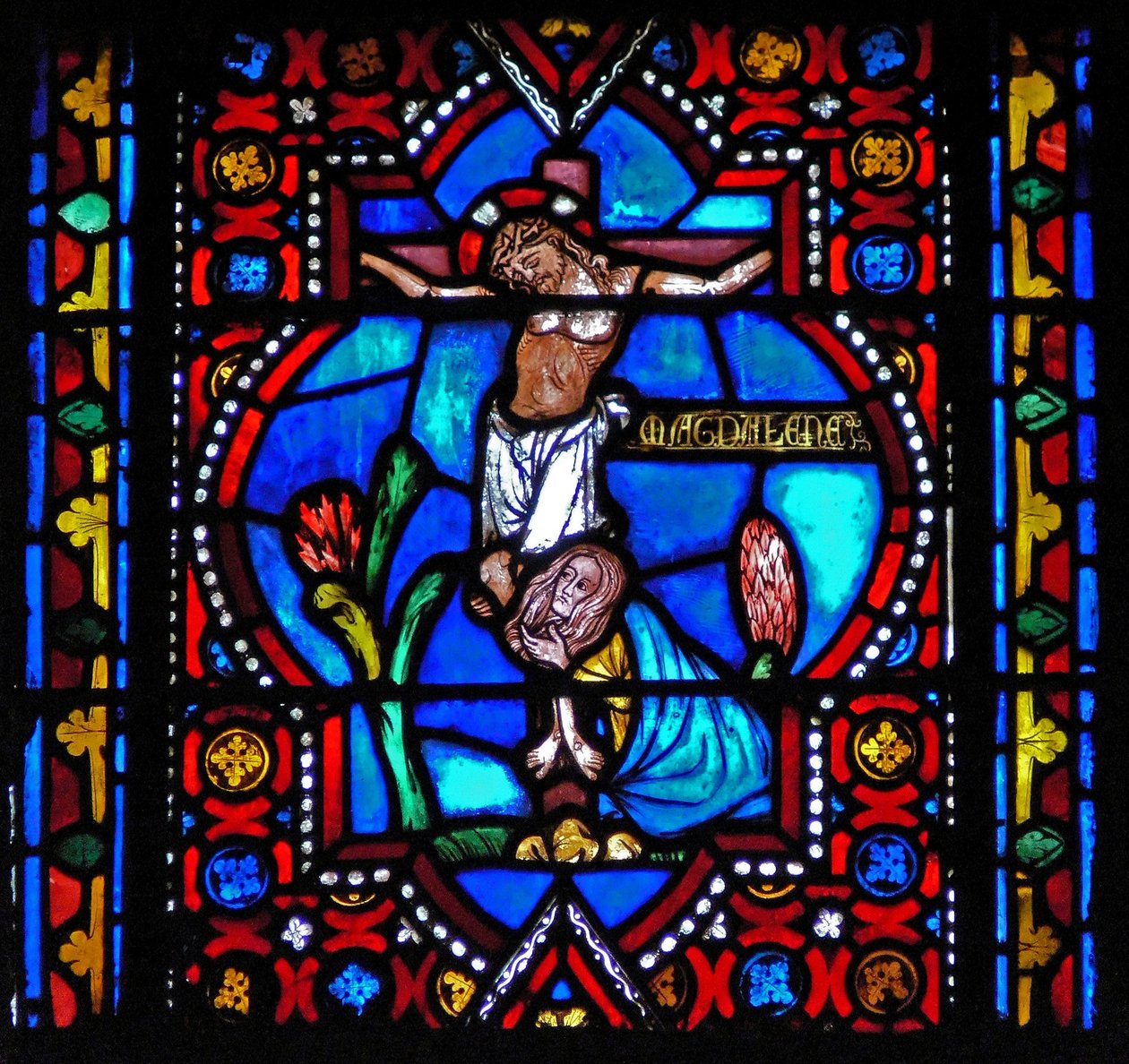Fenêtre n1-L représentant une scène de la vie de Sainte Marie-Madeleine - la sainte au pied de la Croix - French School