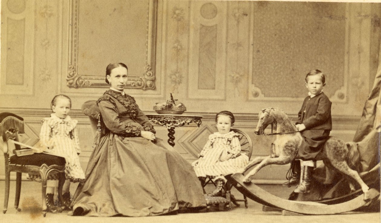 Jeune garçon sur un cheval à bascule entouré de sa famille, années 1860 - Georg Friedrich Brandseph