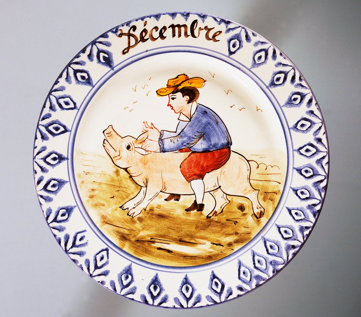 Assiette représentant des mois, décembre, faïence, manufacture Nove di Bassano, région de Vénétie, Italie, XXe siècle. - Italian School