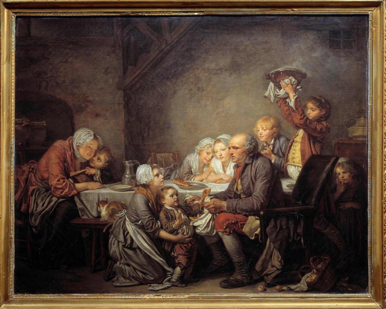 Le gâteau des rois Une famille partageant le gâteau à la fête de l