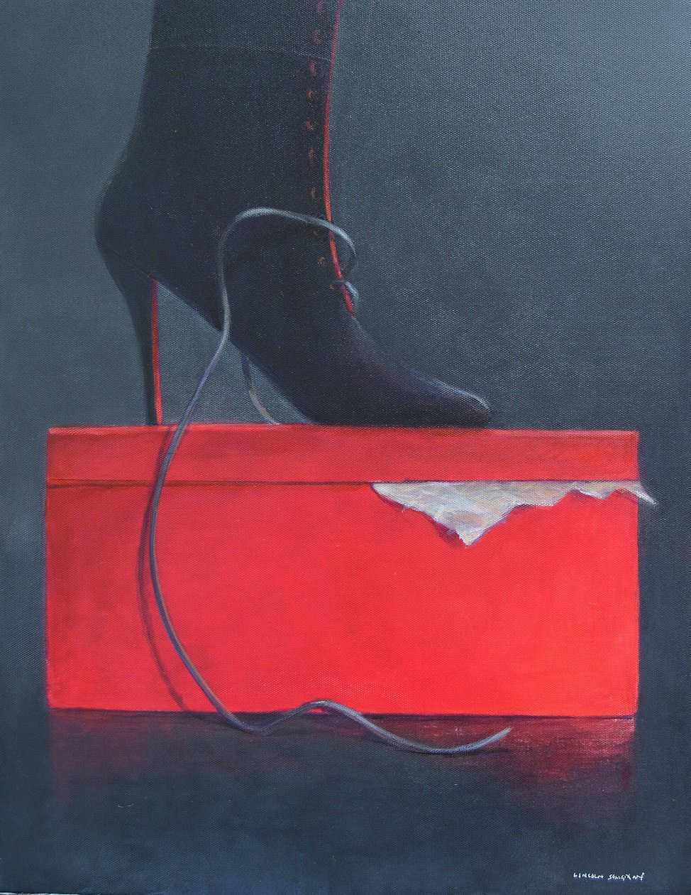botte sur une boîte rouge - Lincoln Seligman
