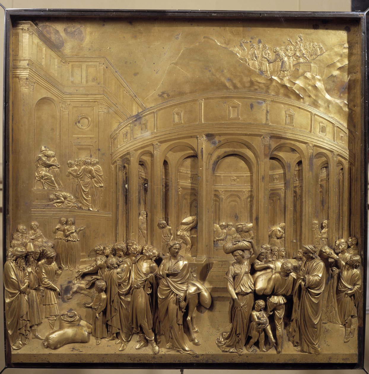 Histoire de la vie de Joseph. La récolte du blé : les paysans apportent les sacs de céréales. Panneau original de la porte du Paradis - Lorenzo Ghiberti