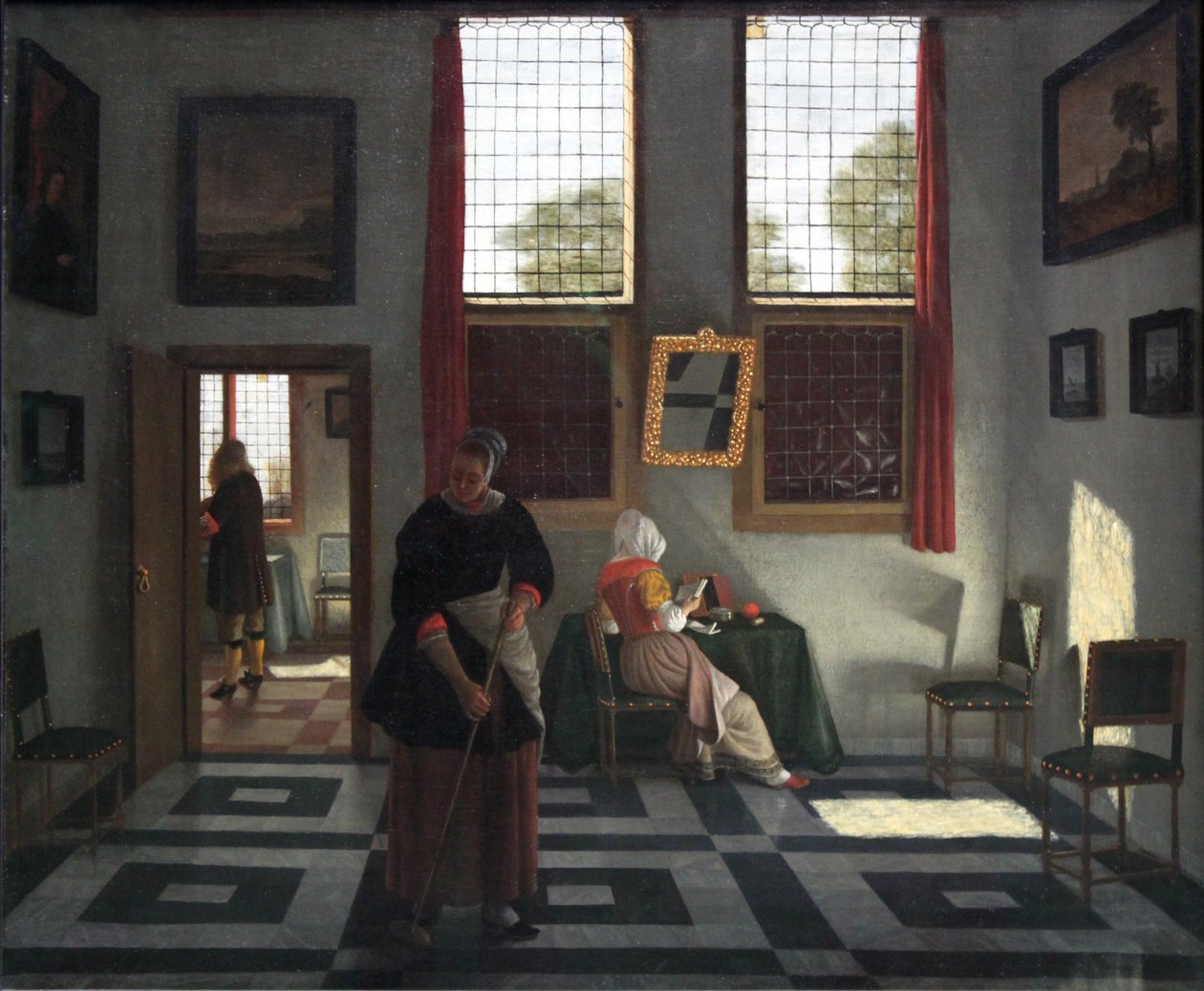 Intérieur avec peintre, dame lisant et servante balayant - Pieter Janssens