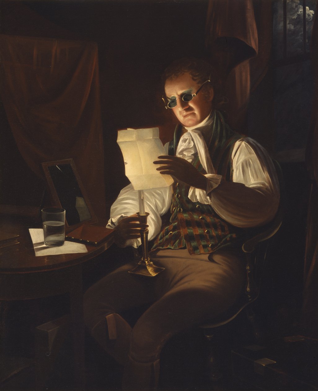 Homme lisant à la lumière d