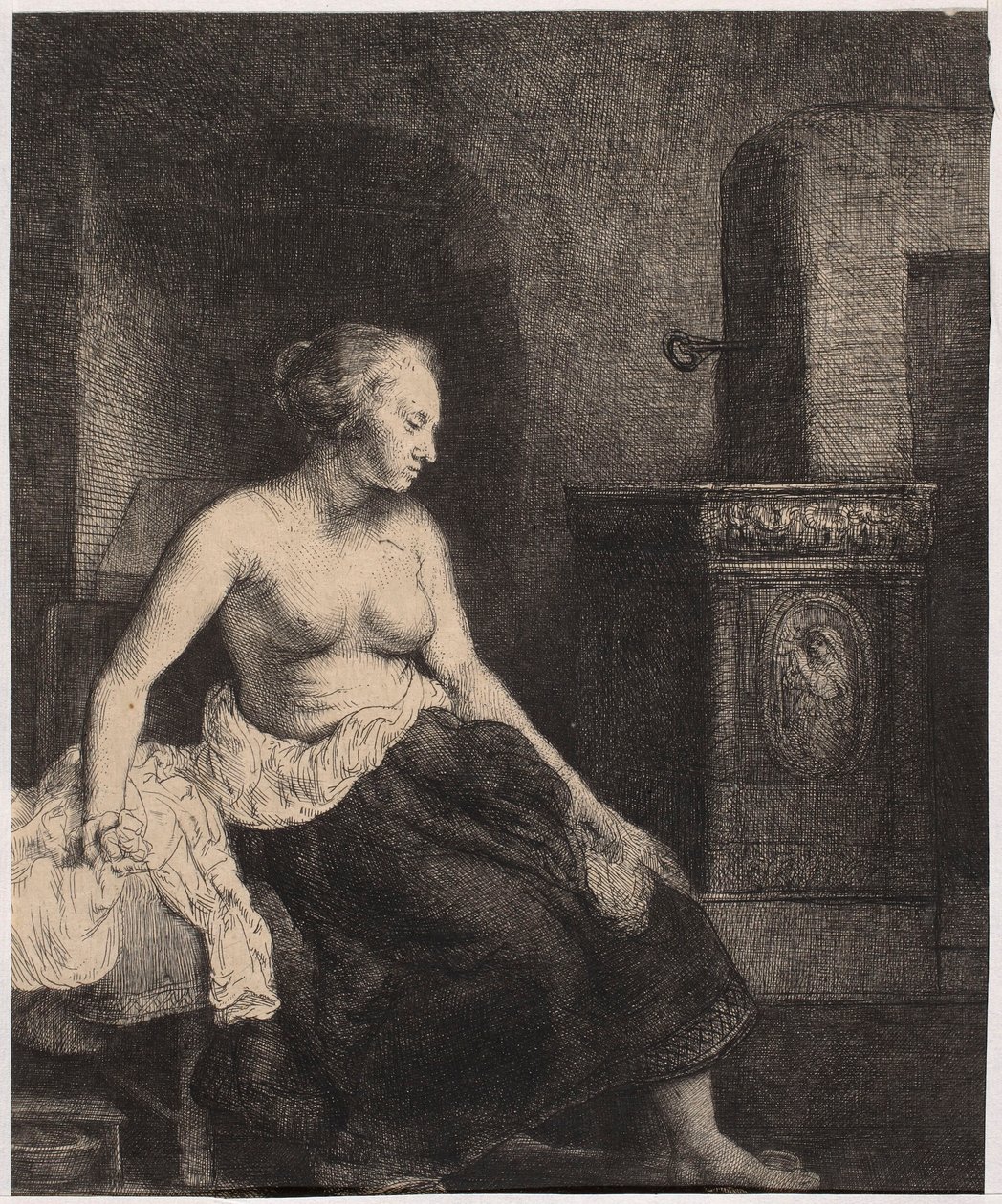 Une femme à demi nue assise près du poêle - Rembrandt van Rijn