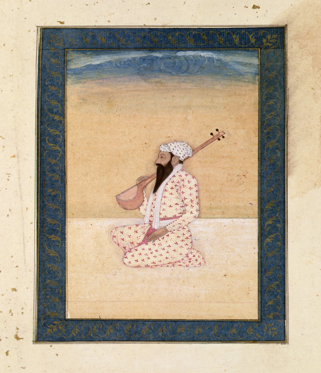 Un joueur de tambura barbu, de l