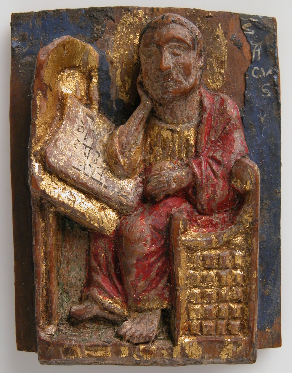 Relief miniature de Saint Marc à sa table d