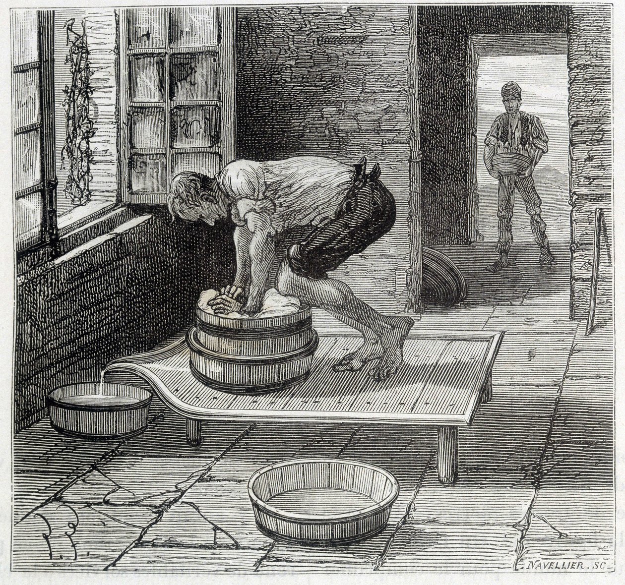 Travail de la Tomme par un fromager d