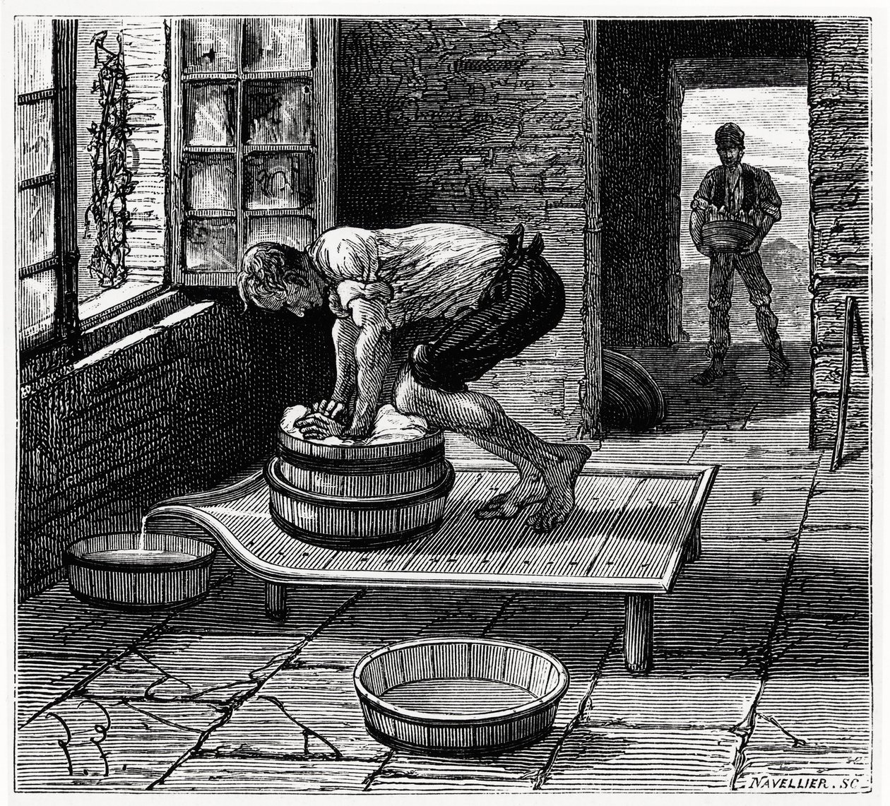 Travail de la tomme par un fromager d