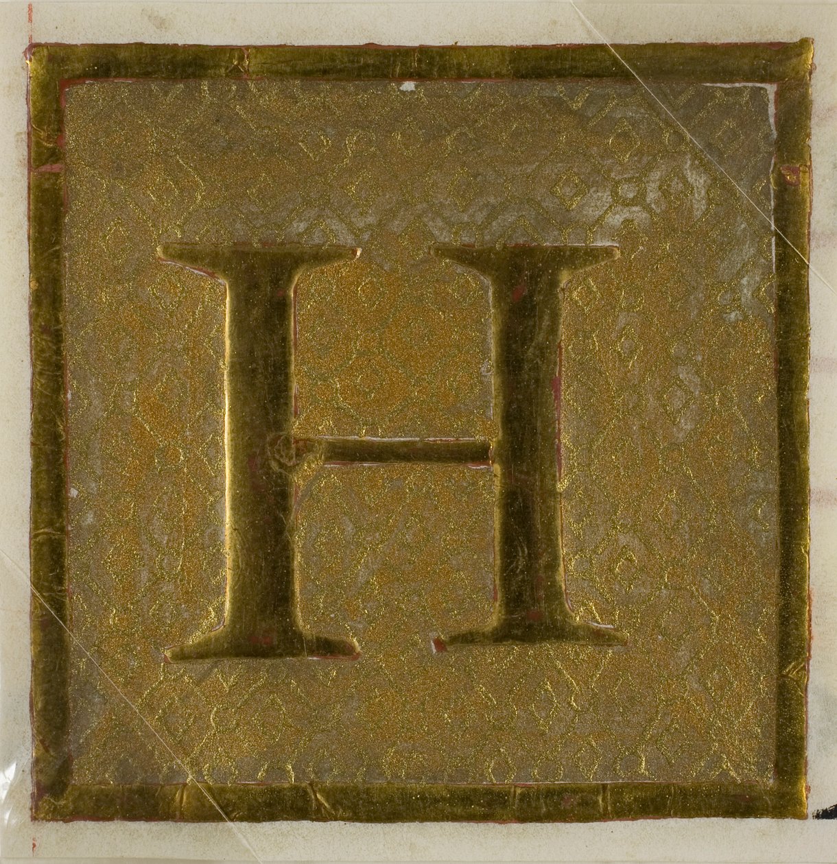 Initiale "H" enluminée dans un motif de couche provenant d