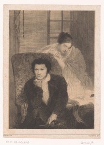 Homme dans un fauteuil avec femme près d