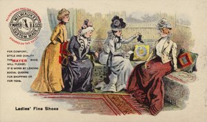 Dames assises sur un canapé admirant des bottes - American School