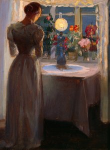 Jeune fille devant une lampe