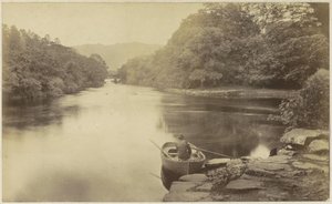 Paysage fluvial en Angleterre, avec un homme en barque au premier plan - Anonymous