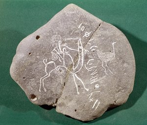 Pierre inscrite avec un chasseur dans le désert et une inscription safaitique, 1er siècle av. J.-C.-3e siècle ap. J.-C.