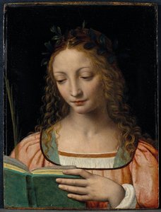 Figure de saint en buste, avec une palme et lisant les écritures