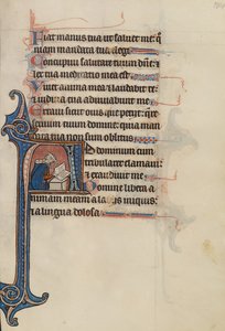 Initiale A : Une noble femme assise par terre en train de lire