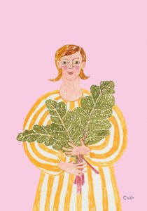 Une femme avec des légumes verts frais