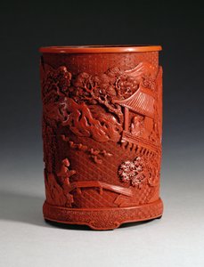 Pot à pinceaux rouge moulé, représentant le célèbre calligraphe Wang Hsi-chih (c.307-365 AD) assis dans son pavillon, regardant des oies dans un étang et un garçon traversant un pont, dynastie Ching, période Qianlong