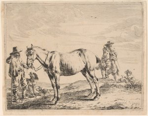 Un homme tenant un cheval par sa bride