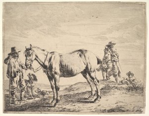Homme tenant un cheval par la bride