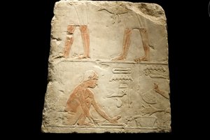Fragment de relief représentant la préparation des aliments (calcaire)