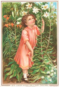 Fille sentant des lys dans le jardin