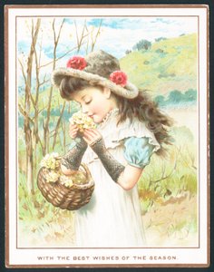 Fille sentant des fleurs d