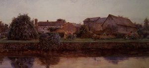 Une maison et des bâtiments de ferme au bord d