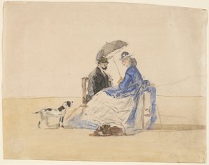 Un couple assis sur la plage avec deux chiens