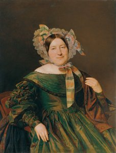 Femme en robe verte changeant au saumon