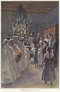 Une famille regardant une crèche près d