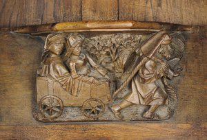 Sculpture représentant un couple dans une charrette tirée par un homme, d