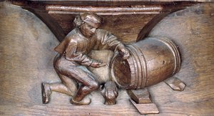 Sculpture représentant un homme mettant un robinet sur un tonneau, d
