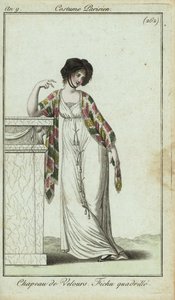 Femme à la mode appuyée sur une cheminée