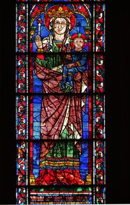 La Vierge (tenant une fleur) et l