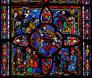 Fenêtre représentant la deuxième section de la fenêtre w7 : au centre est la crucifixion de Saint Pierre ; ailleurs Saint Pierre devant Néron ; Saint Pierre emprisonné ; le diable prend une âme - French School
