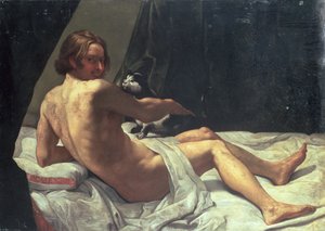 Jeune homme allongé sur un lit avec un chat