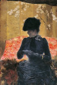 Femme sur un canapé rouge