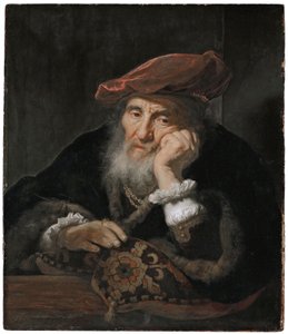 Un vieil homme devant un battant