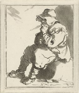 Homme assis sur une pierre