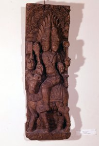 Agni, dieu du feu, représenté avec deux têtes (bicéphale) sur un bélier, selon la mythologie hindoue. Sculpture en bois du XVIIe siècle. Paris, Musée Guimet - Indian School
