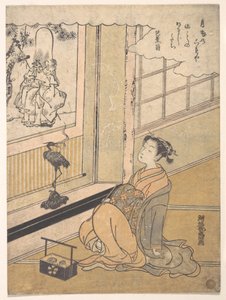 Une jeune femme assise dans une pièce regardant un kakemono de Fukurokujin - Isoda Koryusai